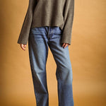 Mocha V-neck knit sweater styled with straight leg denim