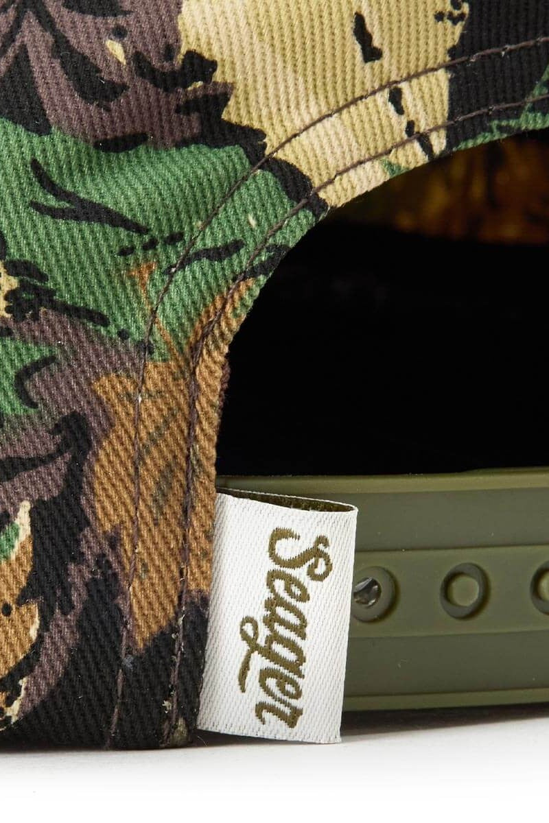 Close up of the camo fabric and snapback closure on the Uncle Bill cap