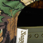 Close up of the camo fabric and snapback closure on the Uncle Bill cap