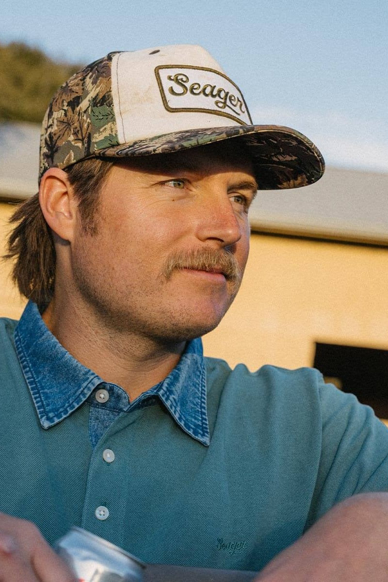 Man wearing the Seager Uncle Bill Hemp Snapback in Camo and Cream