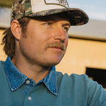 Man wearing the Seager Uncle Bill Hemp Snapback in Camo and Cream