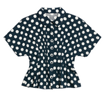 Navy blue shirt with white polka dot pattern on a white background