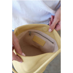 Interior of the Vancouver Bucket Bag showing the Matisse logo and wall pocket