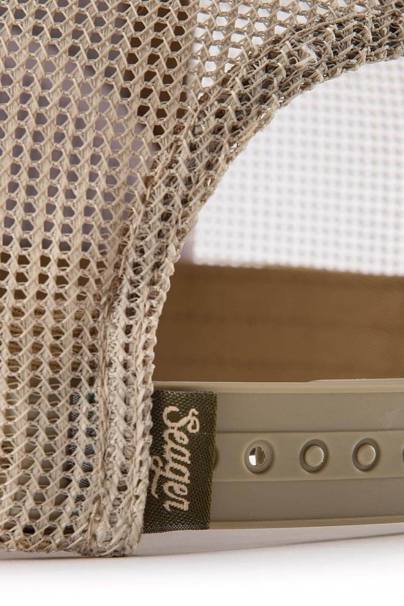 Close up of the mesh back and snapback closure on the Tan and Green Wilson cap