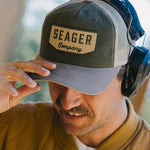 Man wearing the Seager Wilson Waxed Snapback in Tan and Green
