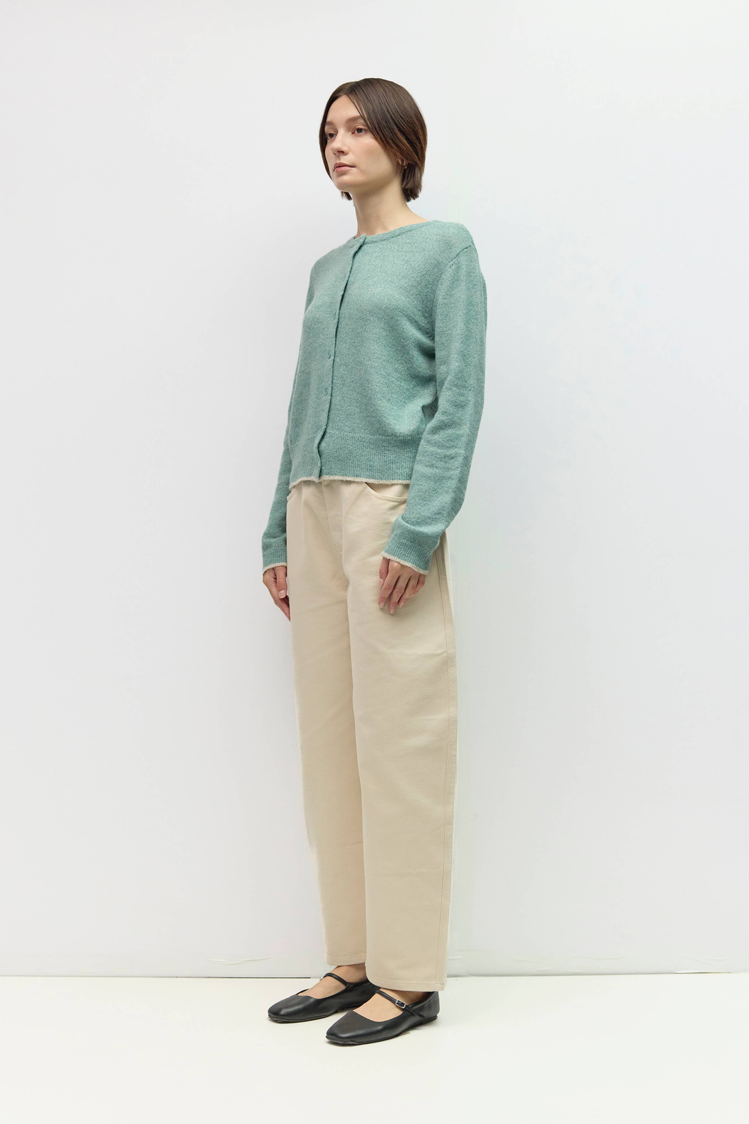 Knit cardigan with contrast trim, side view