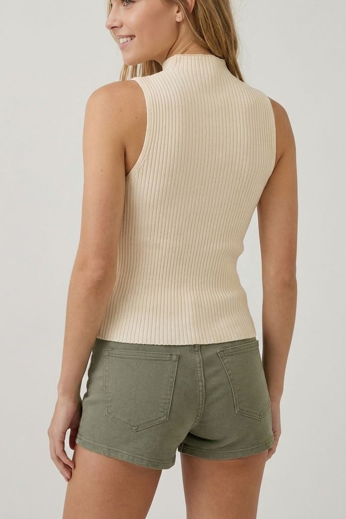 Cream sleeveless turtleneck knit top, back view