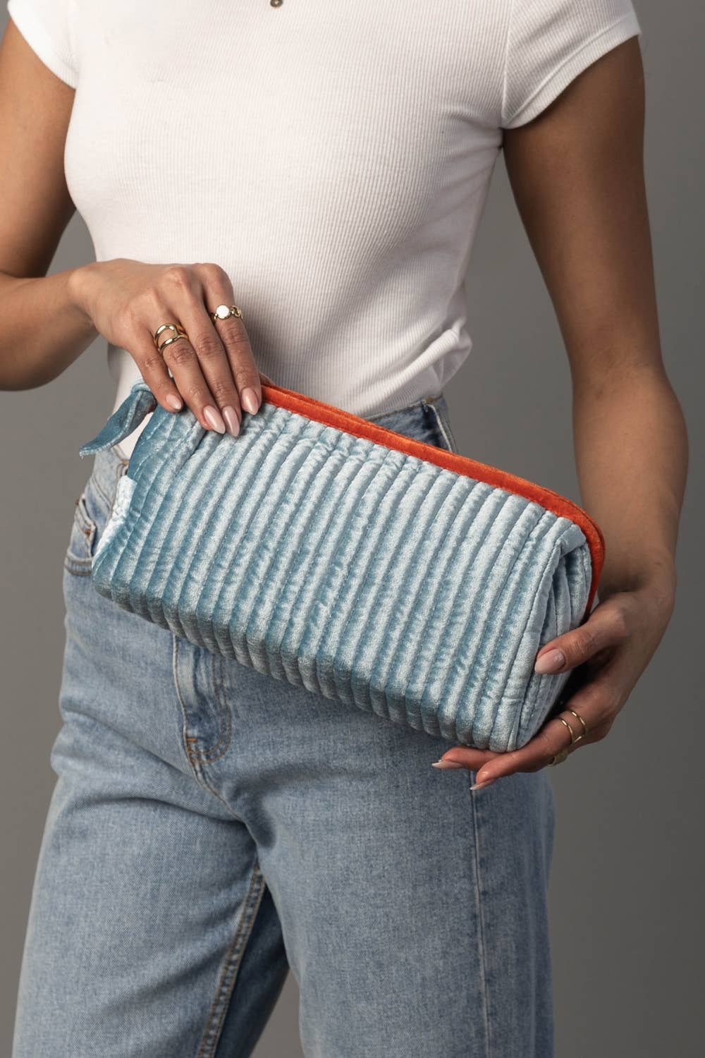 Juniper Velvet Ribbed Pouch in light blue and orange, detail