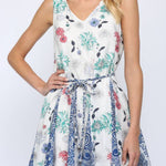 Woman wearing a floral dress on a white background