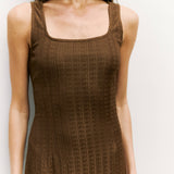 Close up of square neckline and textured knit fabric