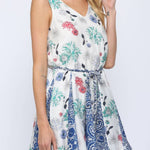 Woman wearing a floral dress on a white background