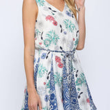 Woman wearing a floral dress on a white background