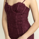 Maroon lace dress on a plain background