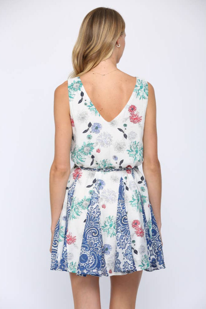 Woman wearing a floral dress with a white background