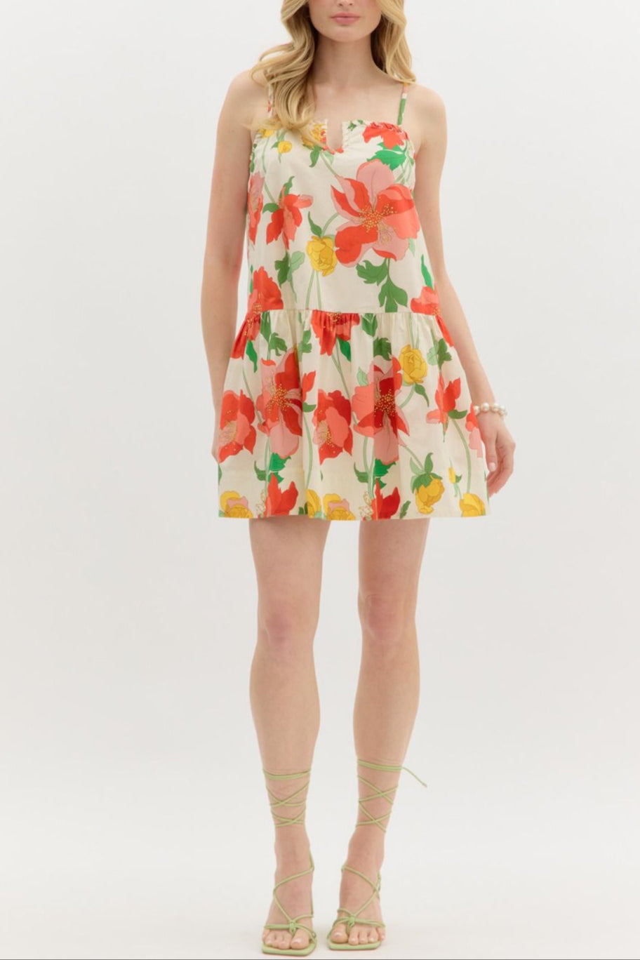 Woman wearing a floral dress on a white background