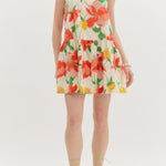Woman wearing a floral dress on a white background