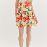 Woman wearing a floral dress on a white background