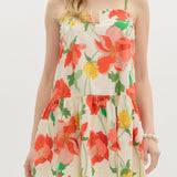 Woman wearing a floral dress on a white background