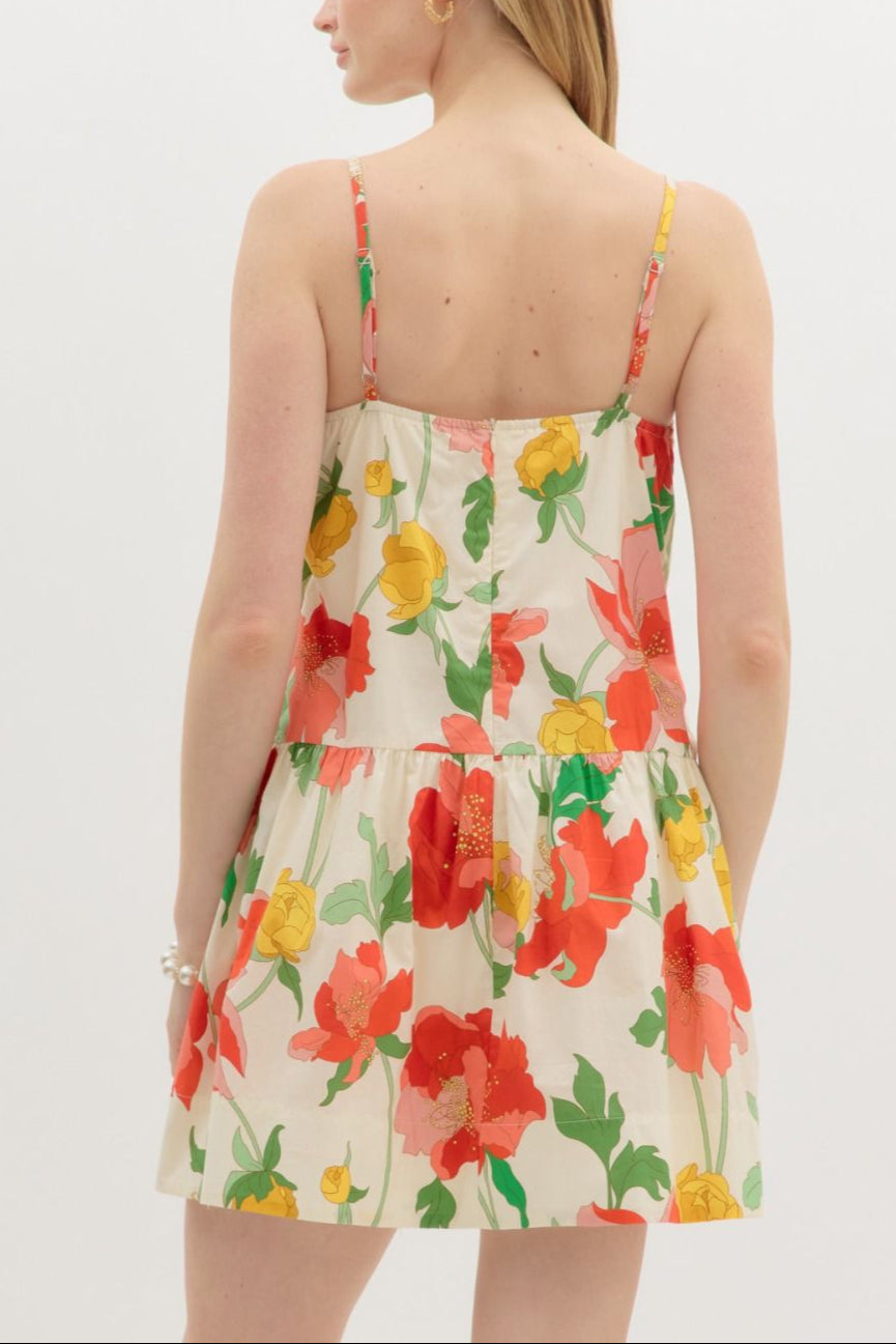 Woman wearing a floral dress with a white background