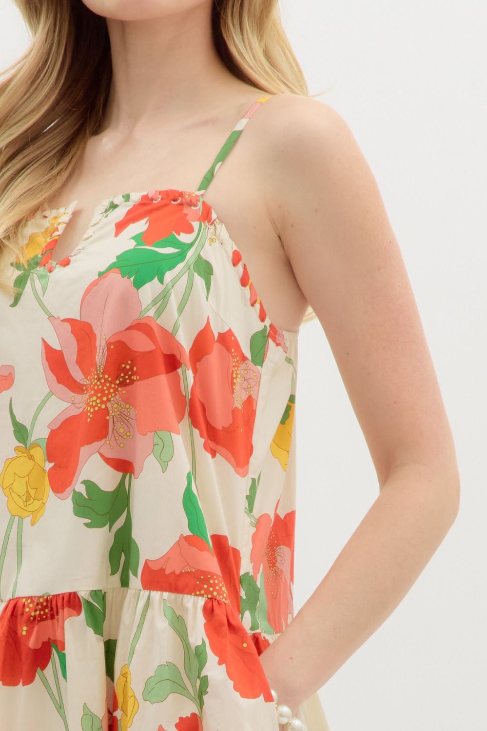 Floral dress with red and green flowers on a white background