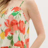 Floral dress with red and green flowers on a white background