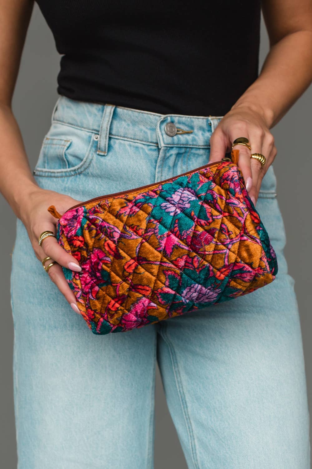 Wildflower Woven Travel Pouch in burnt orange floral, held