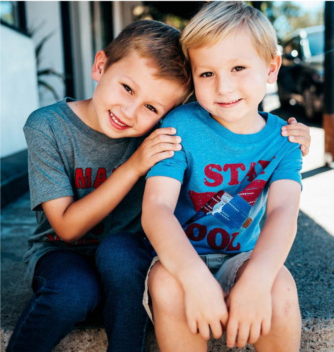 2 young brothers in graphic tees
