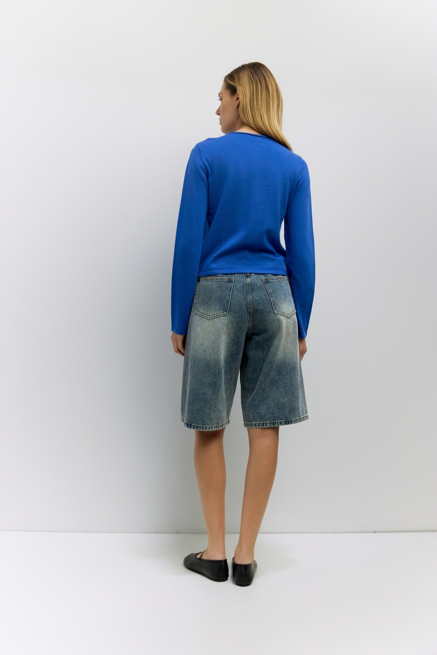 Cambria Rolled Neck Cardigan in blue, side view