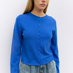 Cambria Rolled Neck Cardigan in blue, detail of rolled neckline and button front