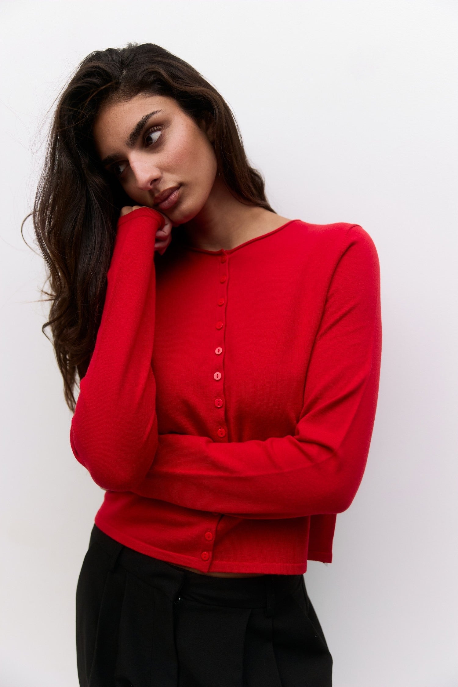 Cambria Rolled Neck Cardigan in red, detail of rolled neckline and button front