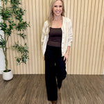 Melanie Clean Line Square Cami in Chocolate under a cream cardigan with black wide-leg jeans