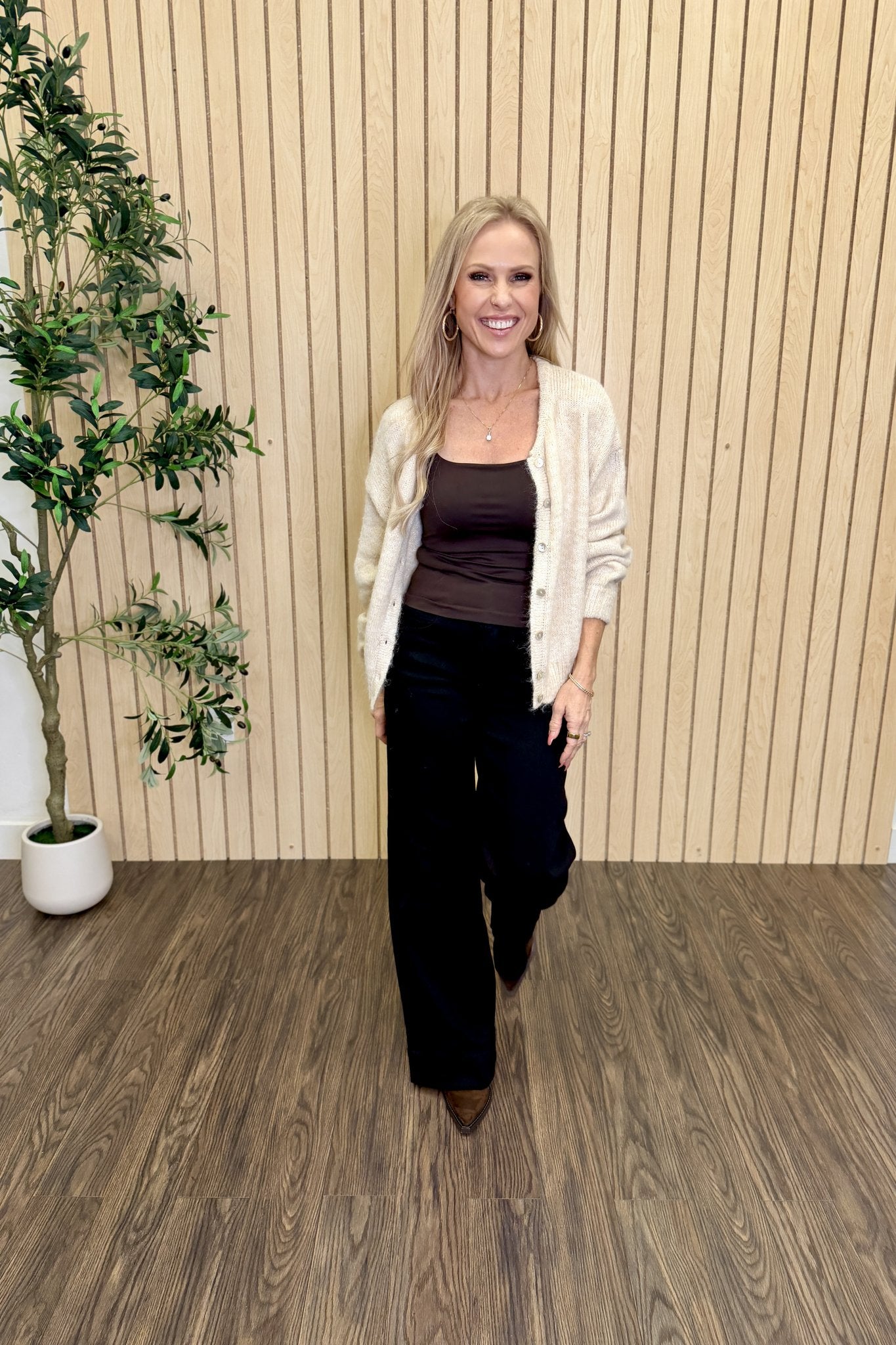 Melanie Clean Line Square Cami in Chocolate under a cream cardigan with black wide-leg jeans