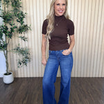 Clove Scallop Mock Neck Sweater in Brown styled on model