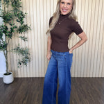 Clove Scallop Mock Neck Sweater in Brown styled on model