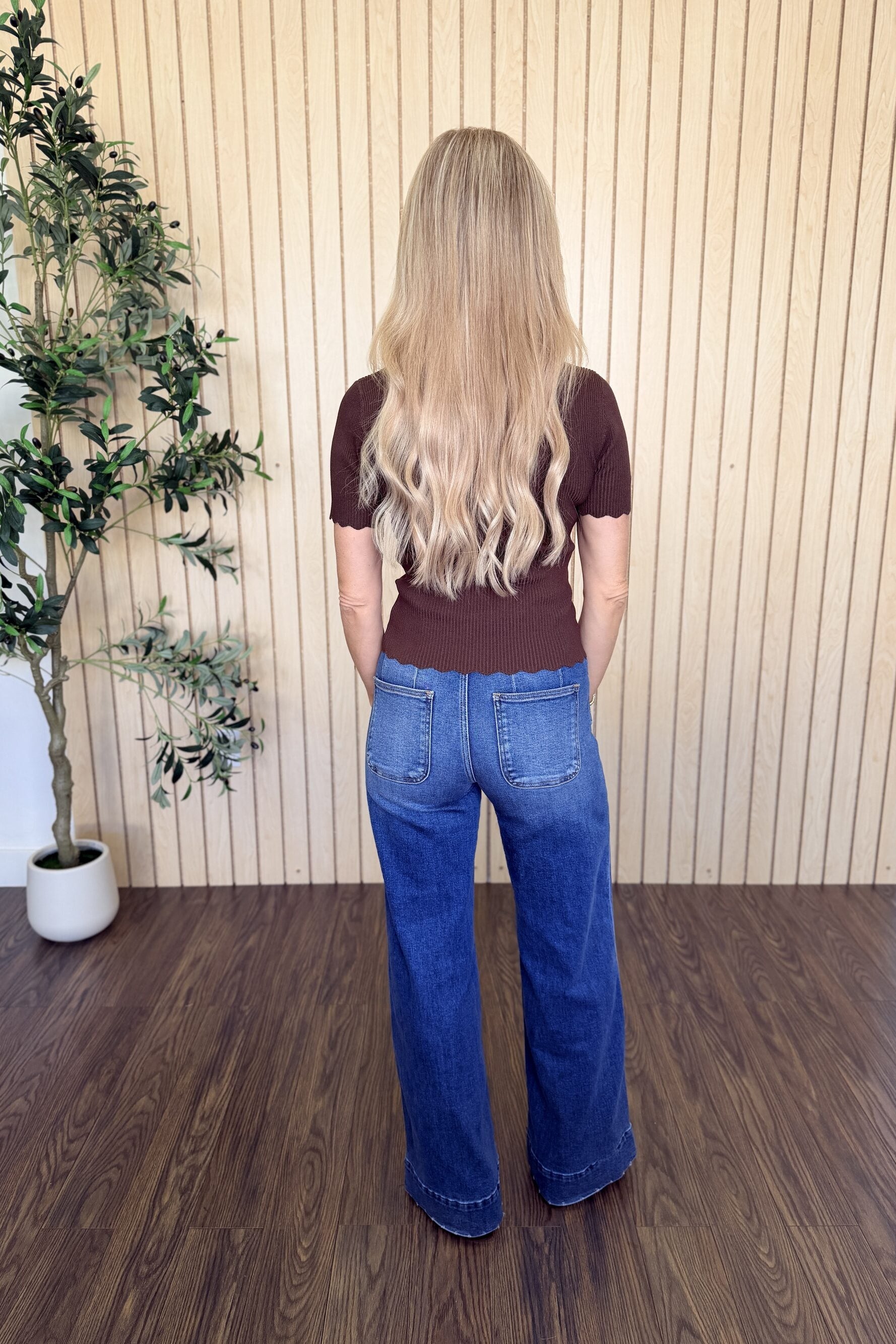 Clove Scallop Mock Neck Sweater in Brown styled on model