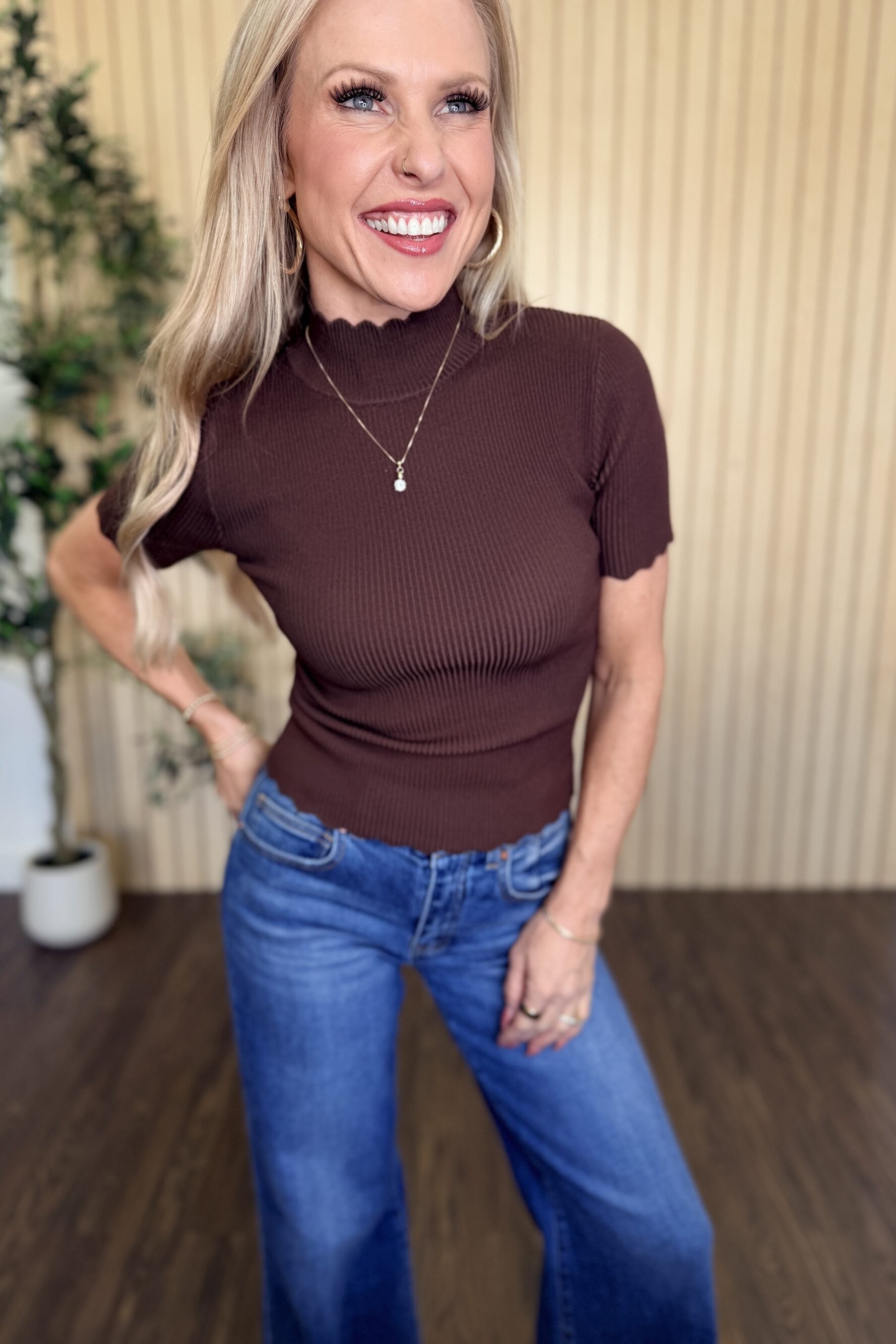Clove Scallop Mock Neck Sweater in Brown styled on model