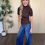 Clove Scallop Mock Neck Sweater in Brown styled on model
