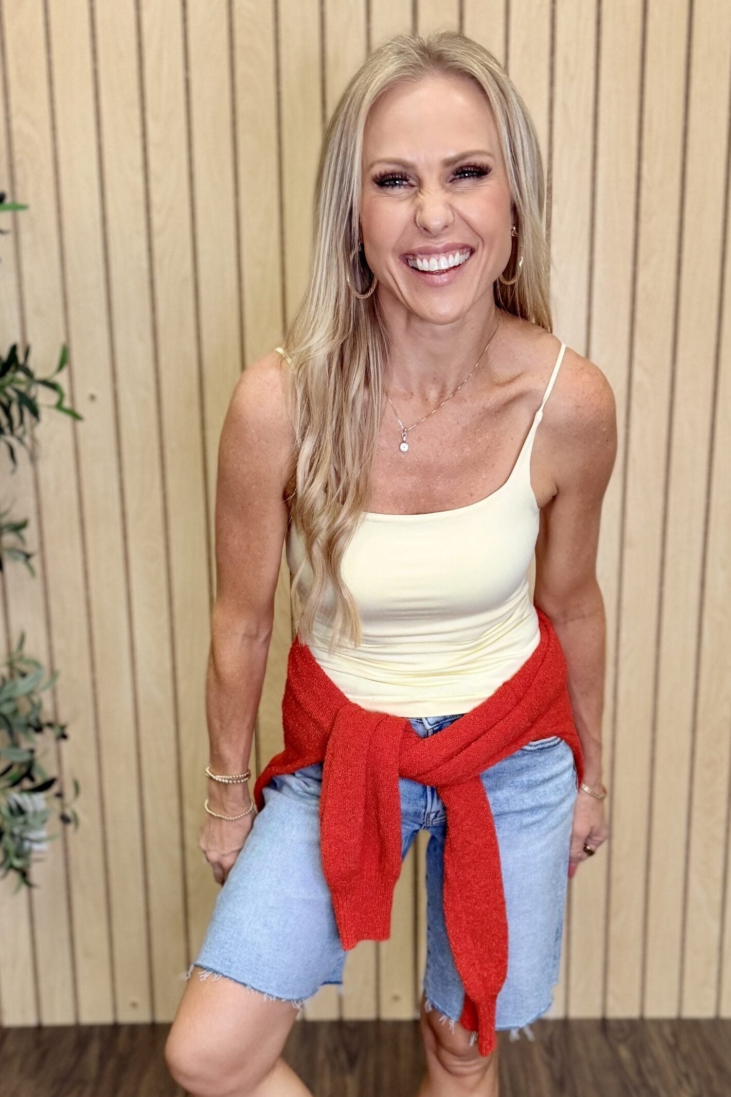 Melanie Clean Line Square Cami in Pale Banana with a red sweater tied at the waist