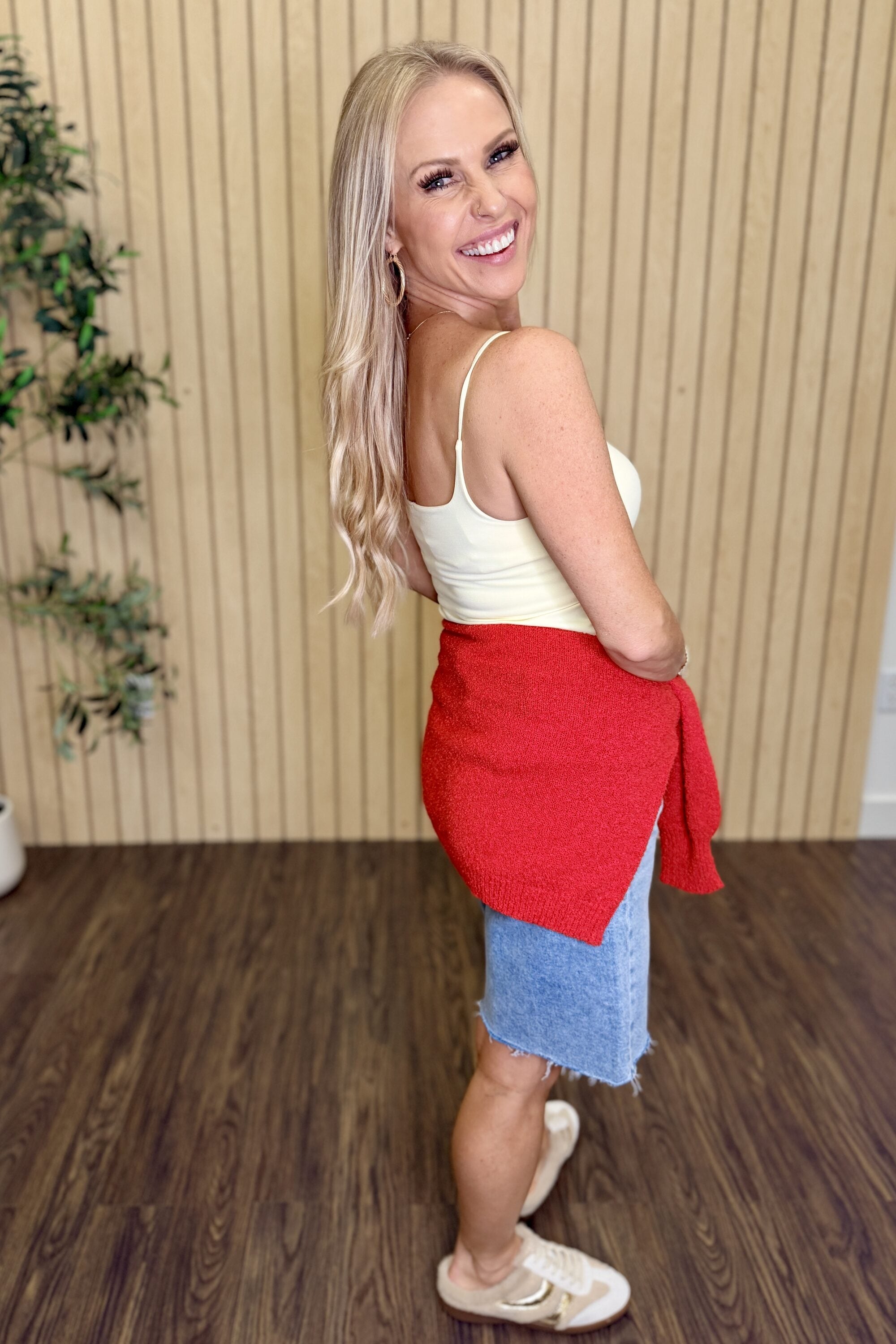 Melanie Clean Line Square Cami in Pale Banana, back view with a red sweater tied at the waist