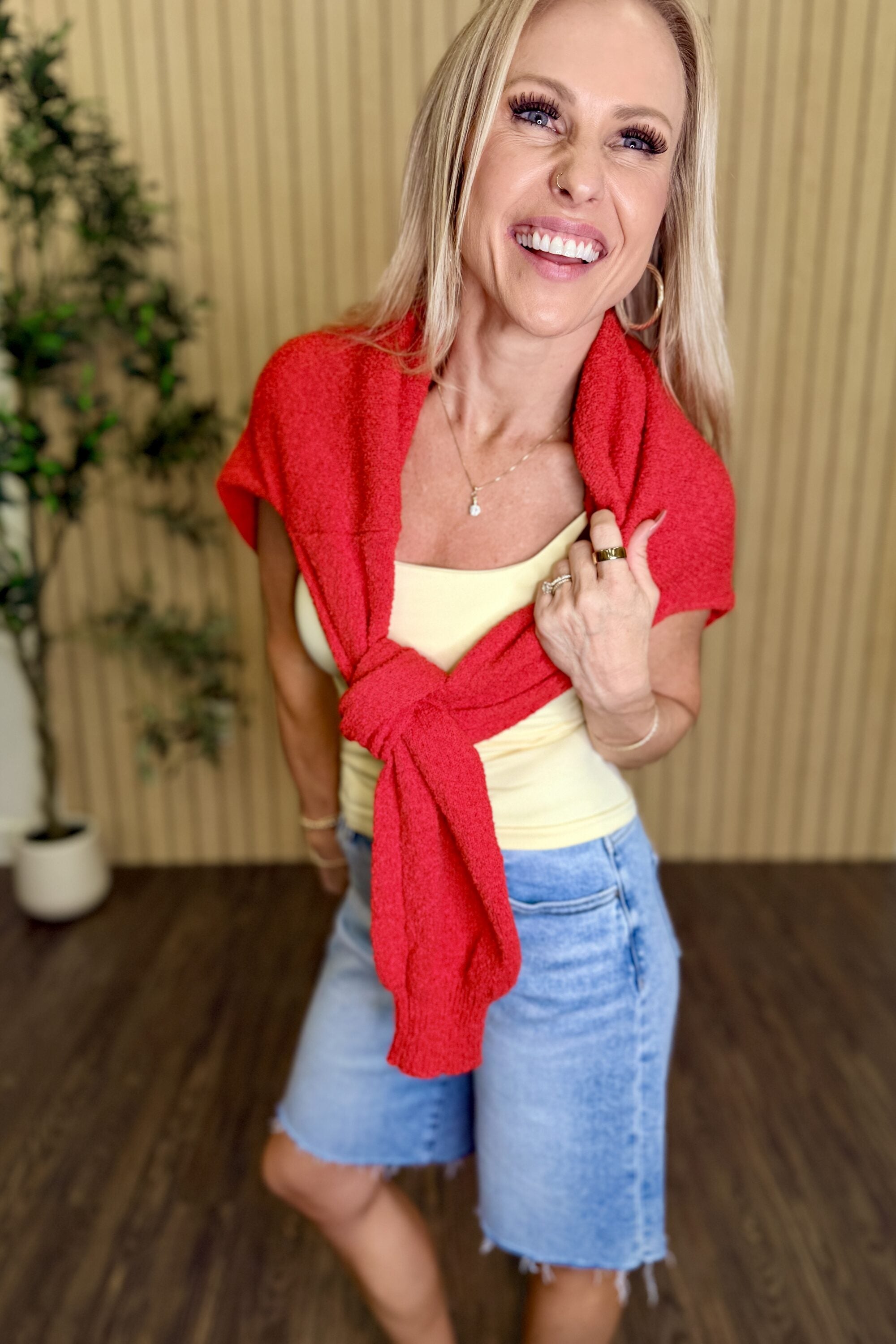 Melanie Clean Line Square Cami in Pale Banana with a red sweater over the shoulders, close-up